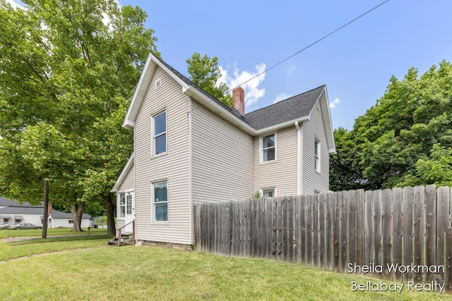 803 S Hanover St, Hastings, MI 49058 - view of side of property with a chimney and entry steps