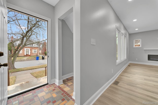 5291 Devonshire Rd, Detroit, MI 48224 - entrance foyer featuring recessed lighting and a glass covered fireplace