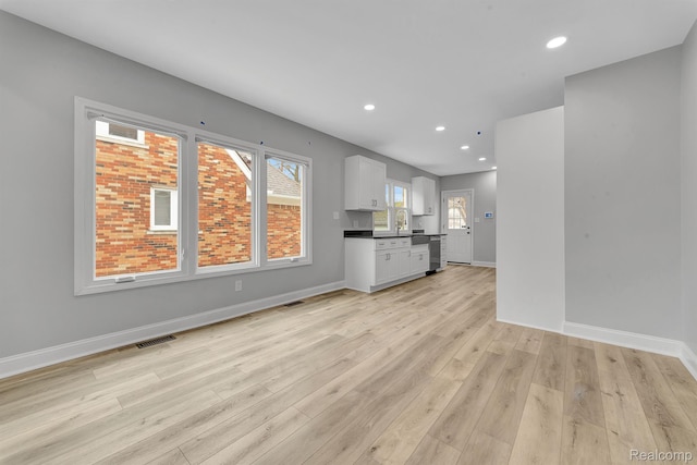 5291 Devonshire Rd, Detroit, MI 48224 - unfurnished living room featuring light wood-type flooring and recessed lighting