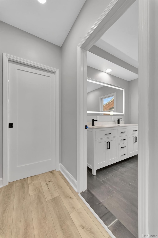 5291 Devonshire Rd, Detroit, MI 48224 - corridor featuring wood finished floors and baseboards