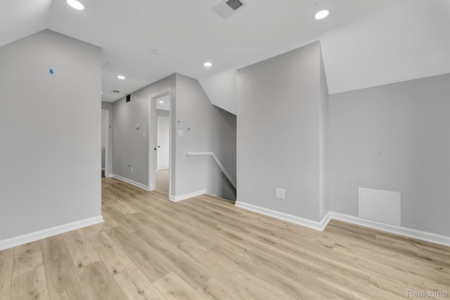 5291 Devonshire Rd, Detroit, MI 48224 - unfurnished living room featuring lofted ceiling, light wood-style flooring, and recessed lighting