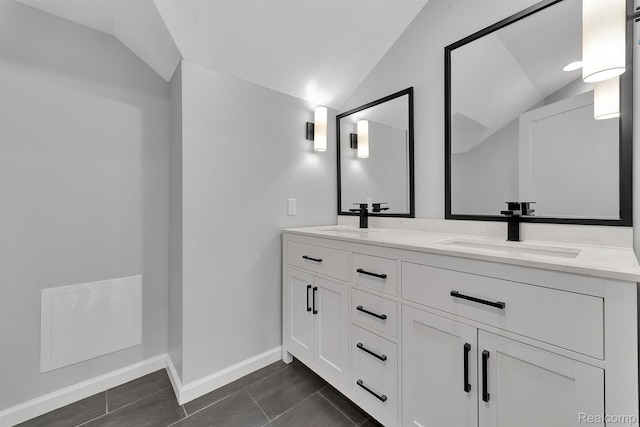 5291 Devonshire Rd, Detroit, MI 48224 - full bath with vaulted ceiling, double vanity, and tile patterned floors