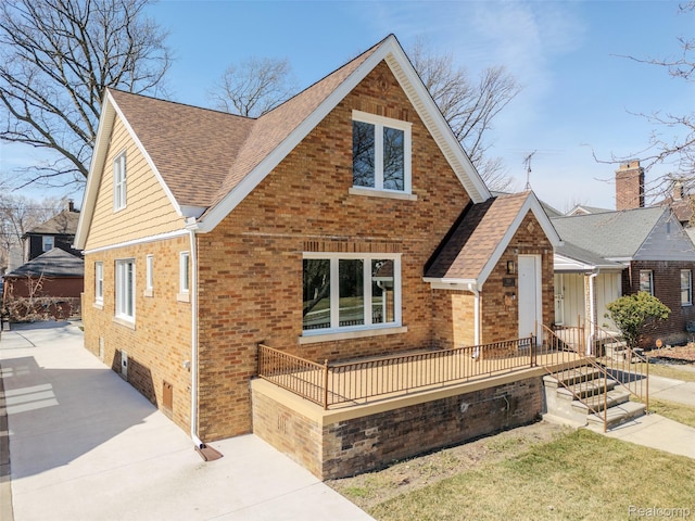 5291 Devonshire Rd, Detroit, MI 48224 - view of front facade featuring brick siding and roof with shingles