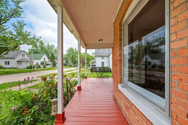 920 Wisconsin Ave, Saint Joseph, MI 49085 - wooden porch featuring a residential view