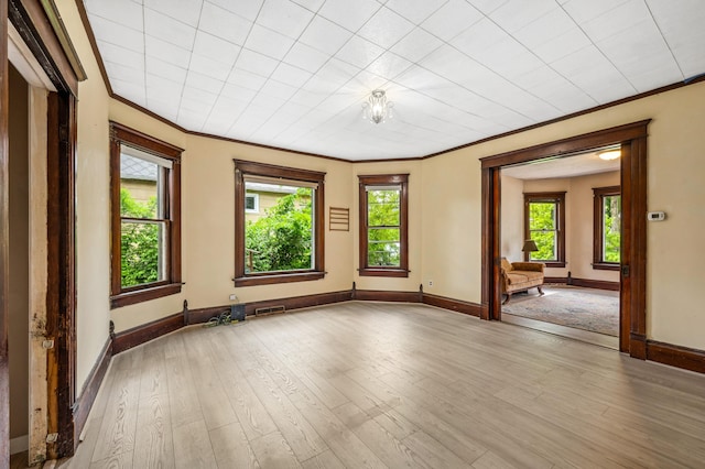920 Wisconsin Ave, Saint Joseph, MI 49085 - spare room featuring crown molding and light wood-style flooring