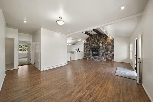 210 W Grove Ave, Michigan Center, MI 49254 - unfurnished living room featuring a baseboard heating unit, dark wood-style floors, recessed lighting, and a stone fireplace