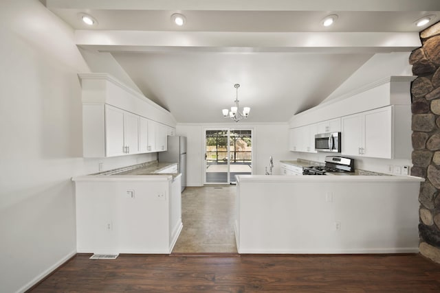 210 W Grove Ave, Michigan Center, MI 49254 - kitchen with appliances with stainless steel finishes, a chandelier, white cabinetry, and light countertops