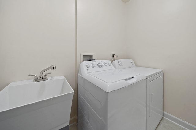 210 W Grove Ave, Michigan Center, MI 49254 - washroom with separate washer and dryer and baseboards