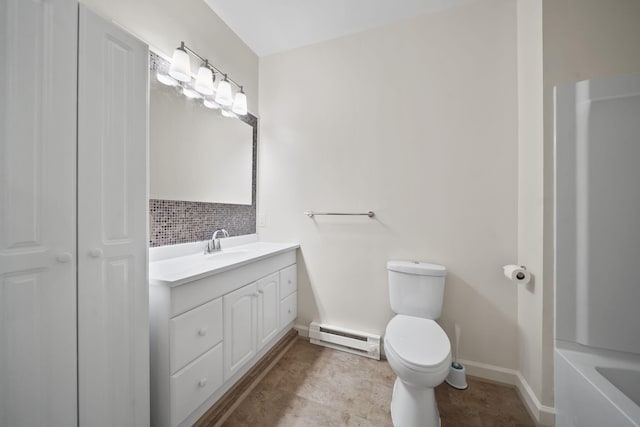 210 W Grove Ave, Michigan Center, MI 49254 - full bathroom with a baseboard heating unit, vanity, backsplash, and a bath