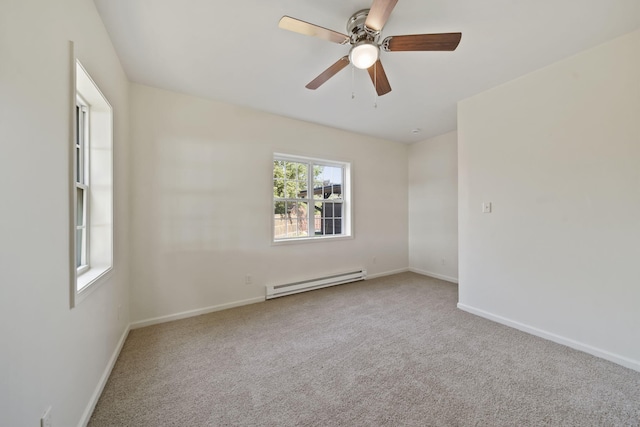 210 W Grove Ave, Michigan Center, MI 49254 - empty room with a baseboard heating unit, carpet, and ceiling fan
