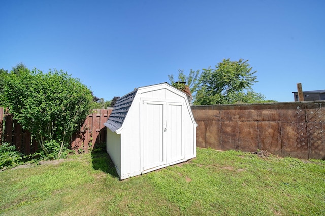 210 W Grove Ave, Michigan Center, MI 49254 - view of shed with a fenced backyard