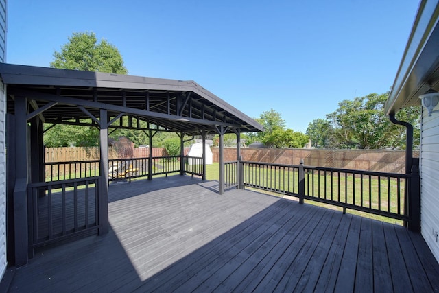 210 W Grove Ave, Michigan Center, MI 49254 - wooden terrace with a storage unit and a fenced backyard