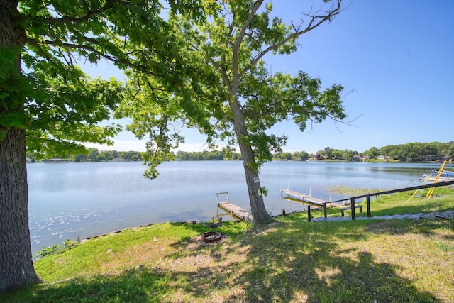 210 W Grove Ave, Michigan Center, MI 49254 - water view featuring a dock and a fire pit