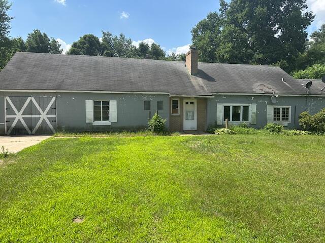 250 131st Ave, Wayland, MI 49348 - view of front facade featuring a front lawn and a chimney