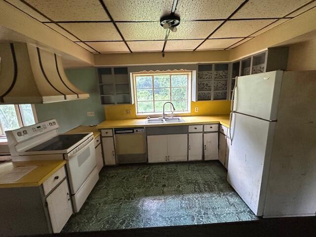 250 131st Ave, Wayland, MI 49348 - kitchen with white appliances, a paneled ceiling, light countertops, open shelves, and white cabinets