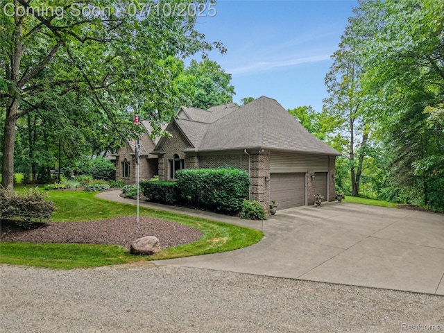 1444 W Clarkston Rd, Lake Orion, MI 48362 - view of front of home featuring brick siding, a garage, driveway, roof with shingles, and a front lawn