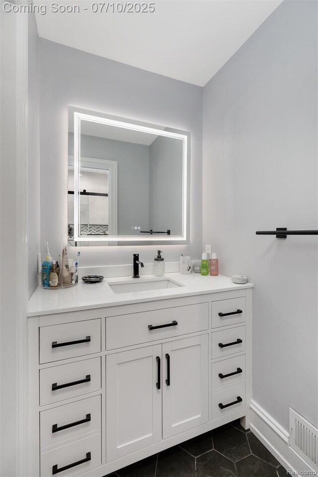 1444 W Clarkston Rd, Lake Orion, MI 48362 - bathroom with vanity and tile patterned flooring
