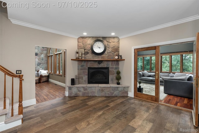 1444 W Clarkston Rd, Lake Orion, MI 48362 - living room featuring ornamental molding, a stone fireplace, hardwood / wood-style floors, stairs, and recessed lighting