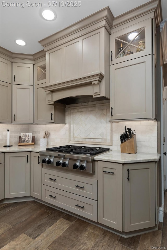 1444 W Clarkston Rd, Lake Orion, MI 48362 - kitchen with stainless steel gas stovetop, backsplash, dark wood-style floors, and cream cabinets