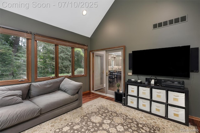 1444 W Clarkston Rd, Lake Orion, MI 48362 - living area featuring wood finished floors and high vaulted ceiling