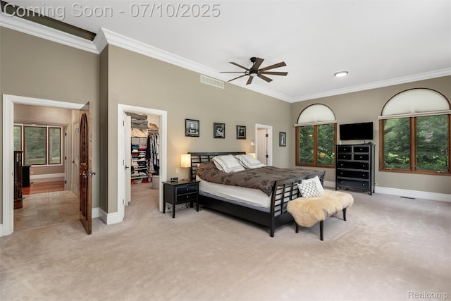 1444 W Clarkston Rd, Lake Orion, MI 48362 - bedroom with light carpet, a spacious closet, ornamental molding, a closet, and ceiling fan