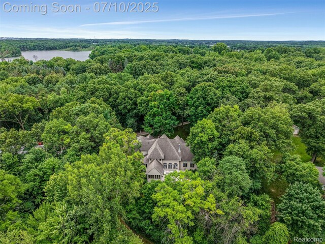 1444 W Clarkston Rd, Lake Orion, MI 48362 - drone / aerial view of a heavily wooded area and a large body of water