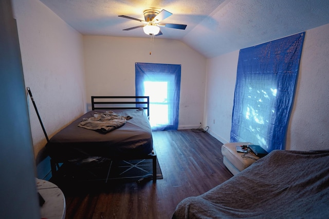 57 S 3rd St, Niles, MI 49120 - bedroom with wood finished floors, vaulted ceiling, a ceiling fan, and a textured ceiling