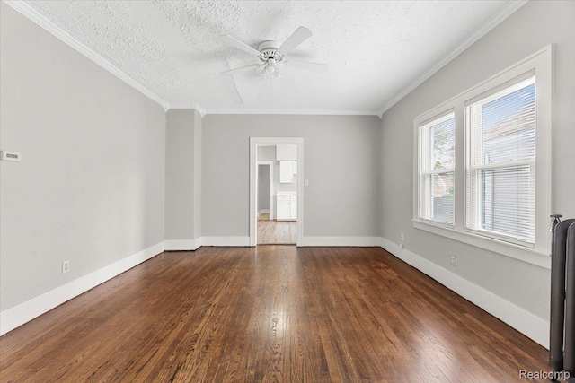 922 Maple, Wyandotte, MI 48192 - spare room featuring dark wood-style flooring, a textured ceiling, ceiling fan, ornamental molding, and radiator