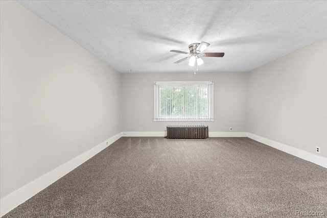 922 Maple, Wyandotte, MI 48192 - empty room with radiator, a ceiling fan, dark colored carpet, and a textured ceiling