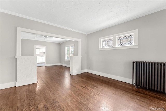 922 Maple, Wyandotte, MI 48192 - unfurnished room with radiator, a ceiling fan, ornamental molding, wood finished floors, and a textured ceiling