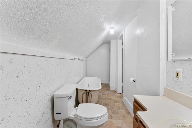 922 Maple, Wyandotte, MI 48192 - bathroom with a textured ceiling, vaulted ceiling, and vanity