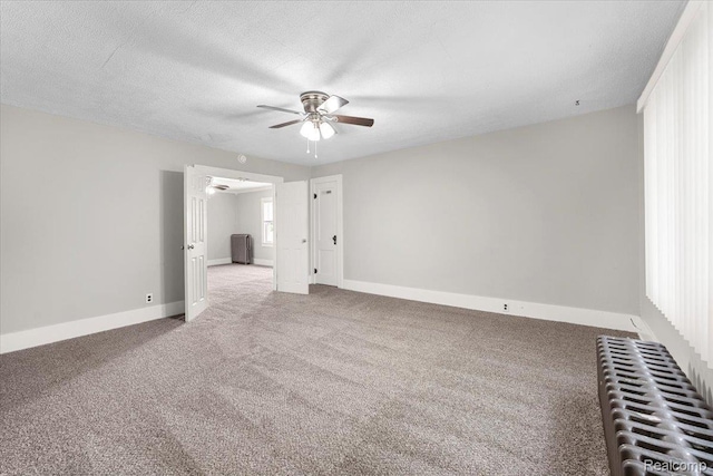 922 Maple, Wyandotte, MI 48192 - carpeted spare room with a ceiling fan, radiator heating unit, and a textured ceiling