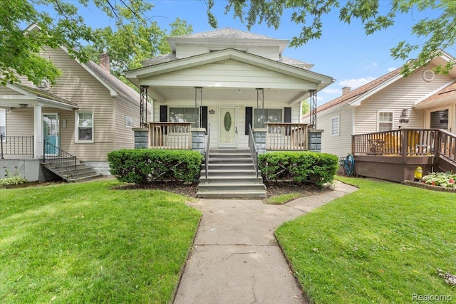 922 Maple, Wyandotte, MI 48192 - view of front of home featuring covered porch and a front yard