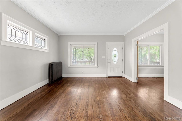 922 Maple, Wyandotte, MI 48192 - entryway with radiator heating unit, a textured ceiling, wood finished floors, and crown molding