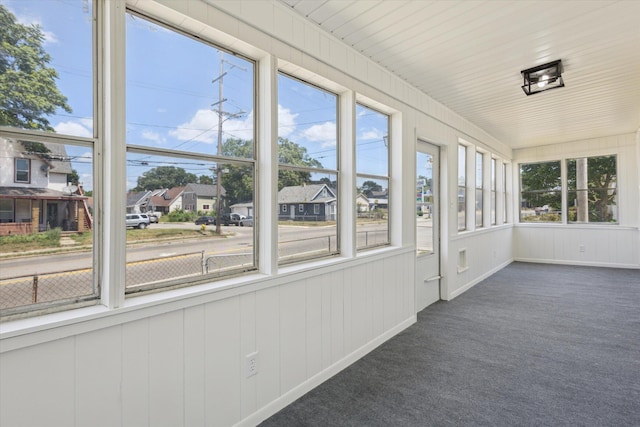400 Burton St SW, Grand Rapids, MI 49507 - unfurnished sunroom featuring healthy amount of natural light, carpet, and a residential view