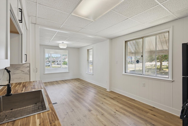 400 Burton St SW, Grand Rapids, MI 49507 - unfurnished dining area with a paneled ceiling and wood finished floors