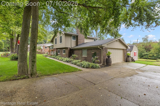5021 Paula Ave, Clarkston, MI 48346 - view of home's exterior featuring brick siding, an attached garage, a lawn, concrete driveway, and a chimney