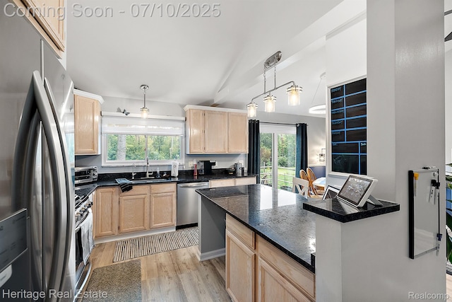 5021 Paula Ave, Clarkston, MI 48346 - kitchen with appliances with stainless steel finishes, light brown cabinets, light wood-style floors, hanging light fixtures, and dark stone counters