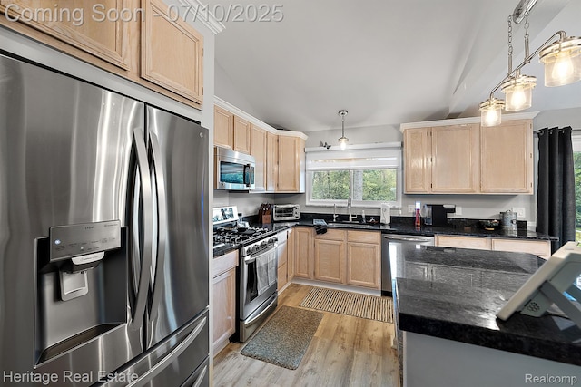 5021 Paula Ave, Clarkston, MI 48346 - kitchen featuring appliances with stainless steel finishes, light brown cabinetry, light wood-style flooring, and dark stone counters