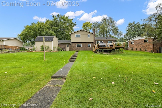 5021 Paula Ave, Clarkston, MI 48346 - rear view of property with a deck, a yard, brick siding, and a shed