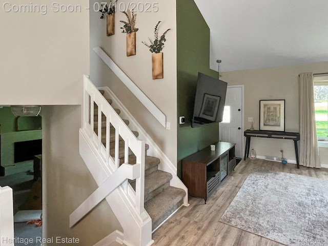 5021 Paula Ave, Clarkston, MI 48346 - staircase with wood finished floors and high vaulted ceiling