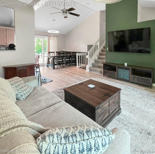 5021 Paula Ave, Clarkston, MI 48346 - living area with wood finished floors, lofted ceiling, and a ceiling fan