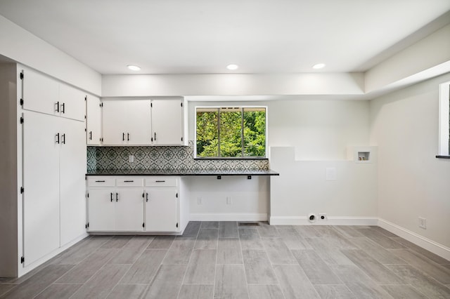3017 Niles Buchanan Rd, Buchanan, MI 49107 - kitchen with white cabinets, dark countertops, decorative backsplash, and recessed lighting