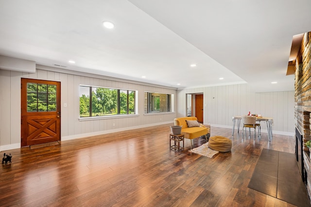 3017 Niles Buchanan Rd, Buchanan, MI 49107 - sitting room featuring wood-type flooring, a fireplace, recessed lighting, and a decorative wall