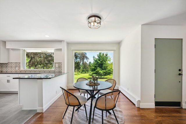 3017 Niles Buchanan Rd, Buchanan, MI 49107 - dining space featuring baseboard heating, plenty of natural light, wood finished floors, and recessed lighting