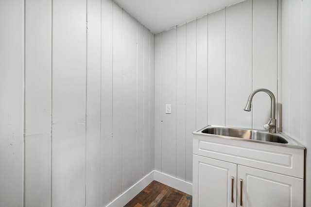 3017 Niles Buchanan Rd, Buchanan, MI 49107 - laundry room with dark wood finished floors and baseboards