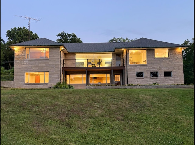 3017 Niles Buchanan Rd, Buchanan, MI 49107 - back of property featuring a balcony, stone siding, and a yard
