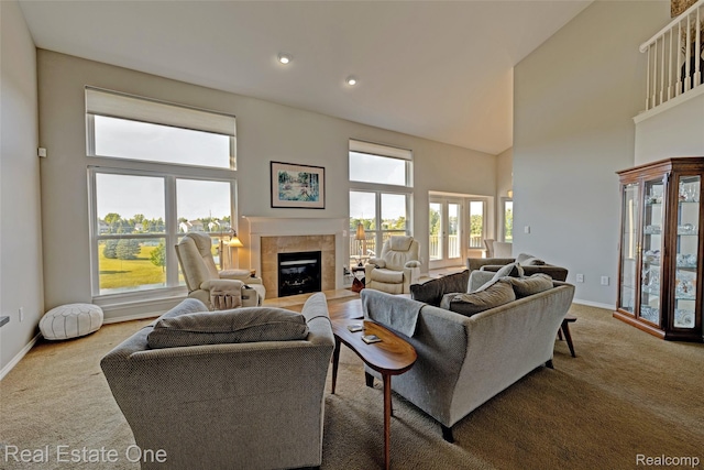 560 Boulder Lake Dr, Oxford, MI 48371 - carpeted living area featuring a tile fireplace, a high ceiling, and recessed lighting