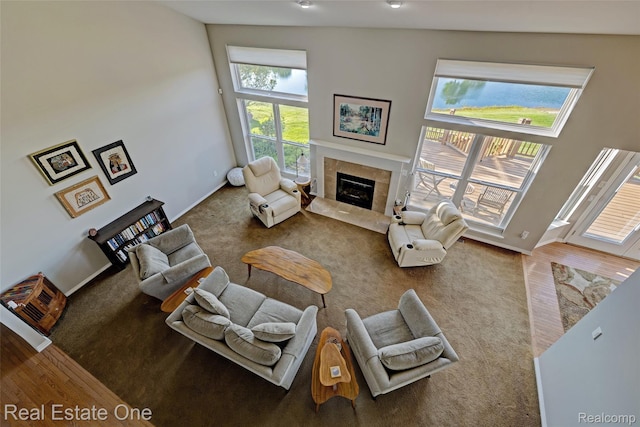 560 Boulder Lake Dr, Oxford, MI 48371 - living area featuring a tile fireplace and wood finished floors