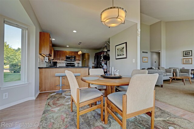 560 Boulder Lake Dr, Oxford, MI 48371 - dining room with light wood-style flooring and recessed lighting